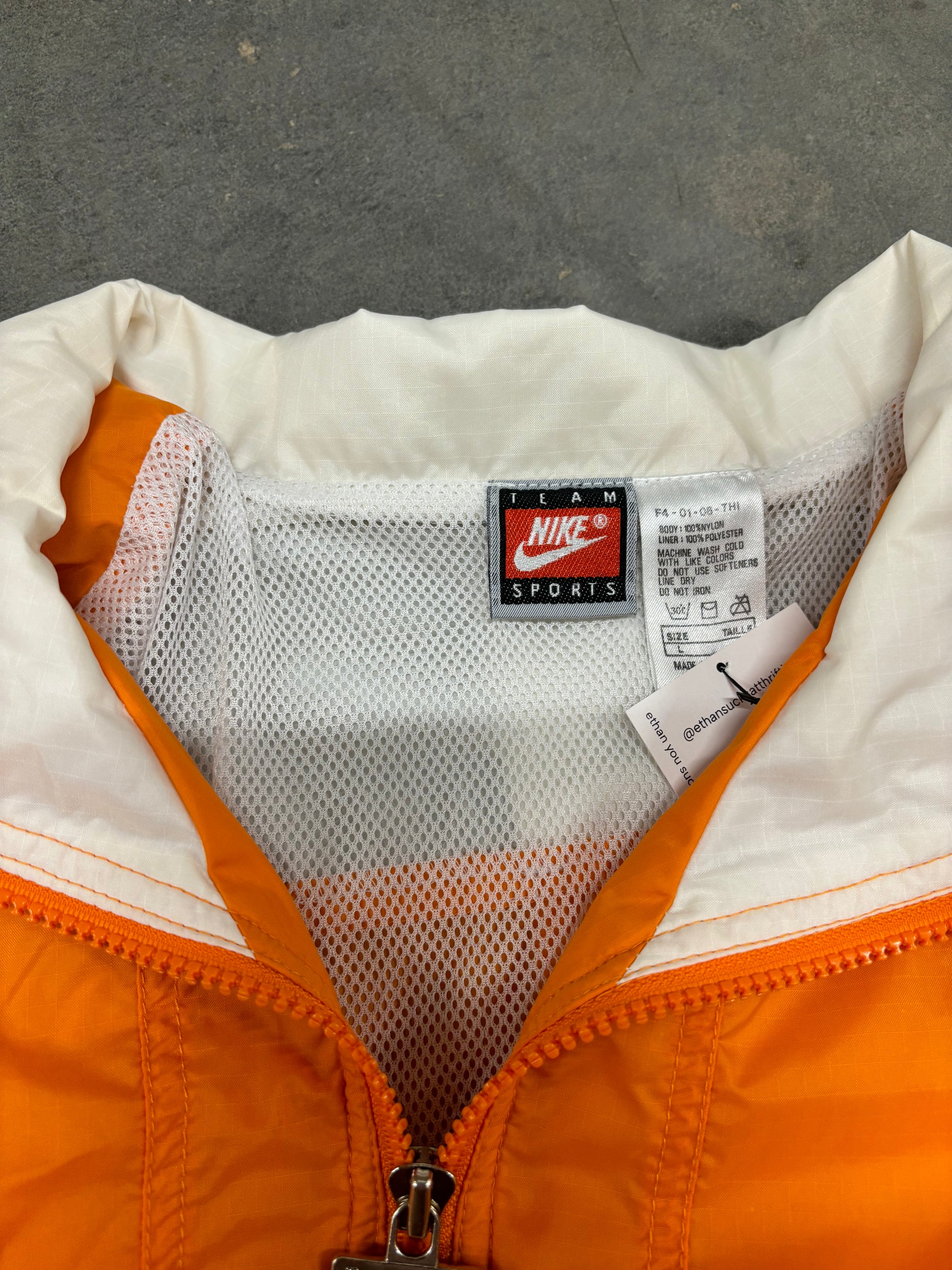 *DISTRESSED* VINTAGE NIKE SPELLOUT WINDBREAKER - XL
